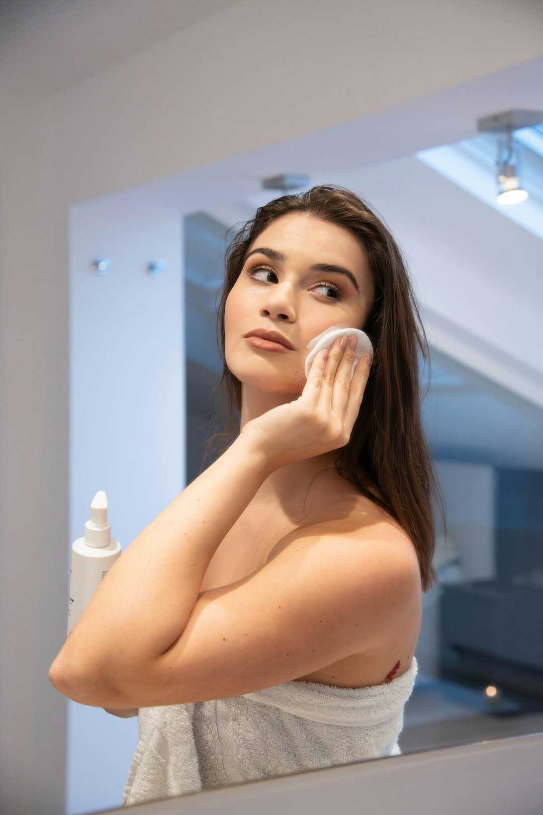 woman applying night cream