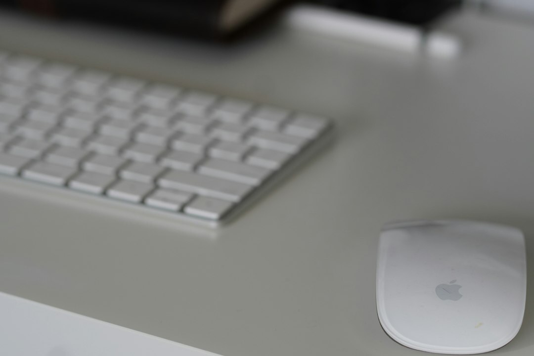 Modern editorial office workspace with laptop and notebook on a desk